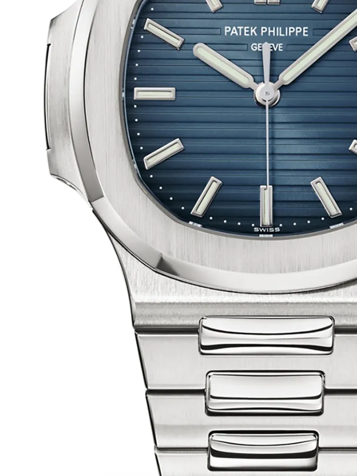 Detail of the Nautilus case flank where the brushed bezel meets the polished chamfer